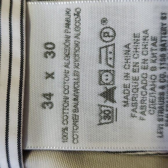 DOCKERS KHAKI SLACKS, Size 34 X 30, pleated front. Side pockets 2 button pockets - Picture 5 of 11